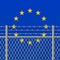 Metal fence with barbed wire on a European Union flag Separation concept Social issues on refugees or illegal immigrants