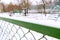 Metal fence and blurred empty dog area playground