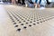 Metal floor tactile to guide vision impaired person at mall