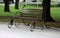 Metal forged bench in summer park