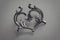 Metal in the form of antique victorian heart on dark background. 3d rendering.