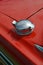 Metal fuel filler cap on classic car.