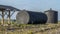 A metal fuel tank in an antique railway yard. Old black Fuel Tank on the village railroad station.