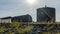 A metal fuel tank in an antique railway yard. Old black Fuel Tank on the village railroad station.