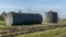 A metal fuel tank in an antique railway yard. Old black Fuel Tank on the village railroad station