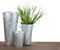 Metal gardening containers with grass