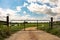 Metal gate on dirt road