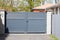 Metal gate grey home fence portal on suburb street house