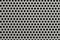 Metal grid texture with holes close-up, silver steel surface, modern background