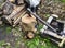 A metal hammer sticks out of a stump. Firewood preparation.