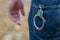 Metal handcuffs in back jeans pocket