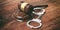 Metal handcuffs and judge gavel on wooden background, 3d illustration