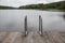 Metal handrail for descent into the lake, iron ladder for swimmers