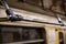 Metal handrails in a subway car with fingerprints. Close-up. Horizontal orientation.