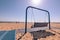 Metal hanging bench swing on a beach in Grand Haven State Park