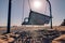 Metal hanging bench swing on a beach in Grand Haven State Park