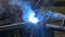 Metal iron laser argon welding industrial robot in factory time lapse 4k.