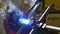 Metal iron laser argon welding robot in factory slow motion.