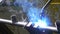 Metal iron laser argon welding robot in factory slow motion.