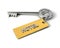 Metal Key with Hotel golden tag isolated on white. Key to Hotel concept. 3d illustration