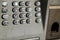 Metal keypad of public phone.