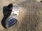 Metal luxury wrist watch drowned in sand