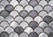 Metal mosaic tile in the form of scales. Silvery tile texture with marine design