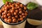 Metal mug with fried chickpeas, closeup