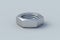 Metal nut on gray background. Construction materials. Industrial equipment. Tools in the workshop.