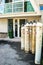 Metal oxygen tanks in front of the hospital doors. The door is marked with a sign with the inscription: