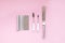 Metal pastry chef\\\'s tools on a pink background. Spatulas and spatulas for making cake