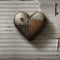 Metal patched heart with key on old paper background