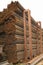 Metal pipes are stored in a warehouse hexagonal cells