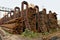 Metal pipes are stored in a warehouse hexagonal cells