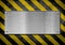 Metal plate background with hazard stripes