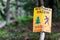 Metal plate sign with Polish language. Forbiden entry and forbiden chopping tree. Nature concept image for saving