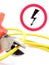 Metal pliers, green yellow cable and high voltage danger sign