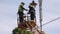 metal pole, Technician on aerial, repair street lamp,