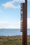 Metal post with sigh Rosses point beach in county Sligo,