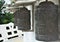 Metal prayer wheels at a white stupa in  Hungary.