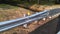 Metal protective barrier with reflective yellow marking sign at newly constructed small bridge 2-C-504. NJ, USA. Ð“.