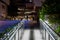 Metal railing to a business building at night