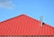 Metal roof construction. Metal Tile Roofing. Roofing Construction with steel chimney.