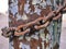 Metal rust chain around pillar, abstract grunge background