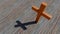 Metal rusted cross on a natural wood or wooden logg background