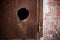 Metal rusted door with hole