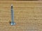 Metal screw on desk metallic master construction crafting