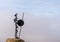 Metal sculpture of Don Quijote perched on a rock at the windmills of Mota del Cuervo