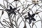 Metal sculpture / public art: Close up detail of a wrought iron flowers in a sculpted gate. 6
