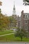 A metal sculpture stands in front of the Baker Tower on the campus of Dartmouth College in Hanover, New Hampshire